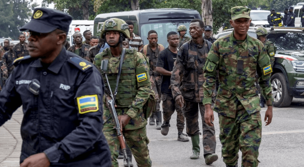 Rwandan security officers escort members of the DRC armed forces (FARDC) who surrendered in Goma on January 27, 2025. (Photo: REUTERS/Jean Bizimana)