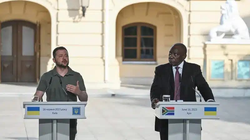 Ukraine s President Volodymyr Zelensky L gestures next to South Africa s President Cyril Ramaphosa as they address media after their talks in Kyiv