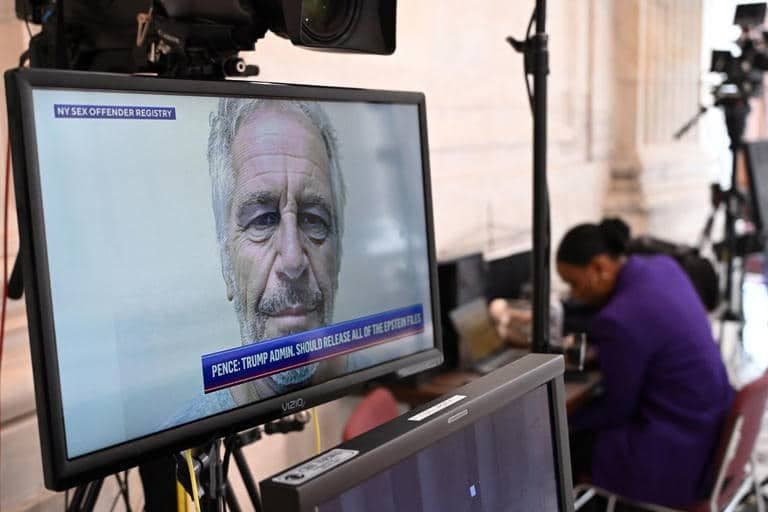 A photo of Jeffrey Epstein on a television screen at the US Capitol in Washington