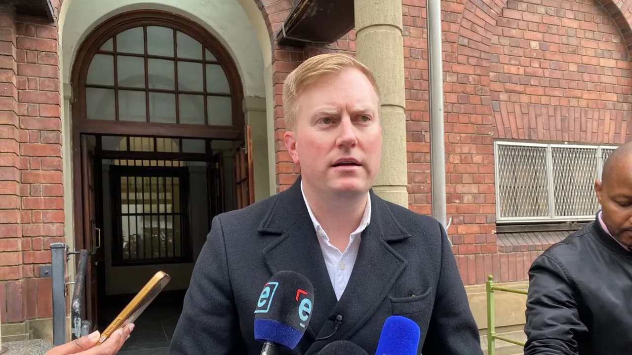 Public Works Minister Dean Macpherson outside the Cape Town Central Police station on Thursday 7 August 2025 where hes opened a criminal case against the IDT CEO Tebogo Malaka