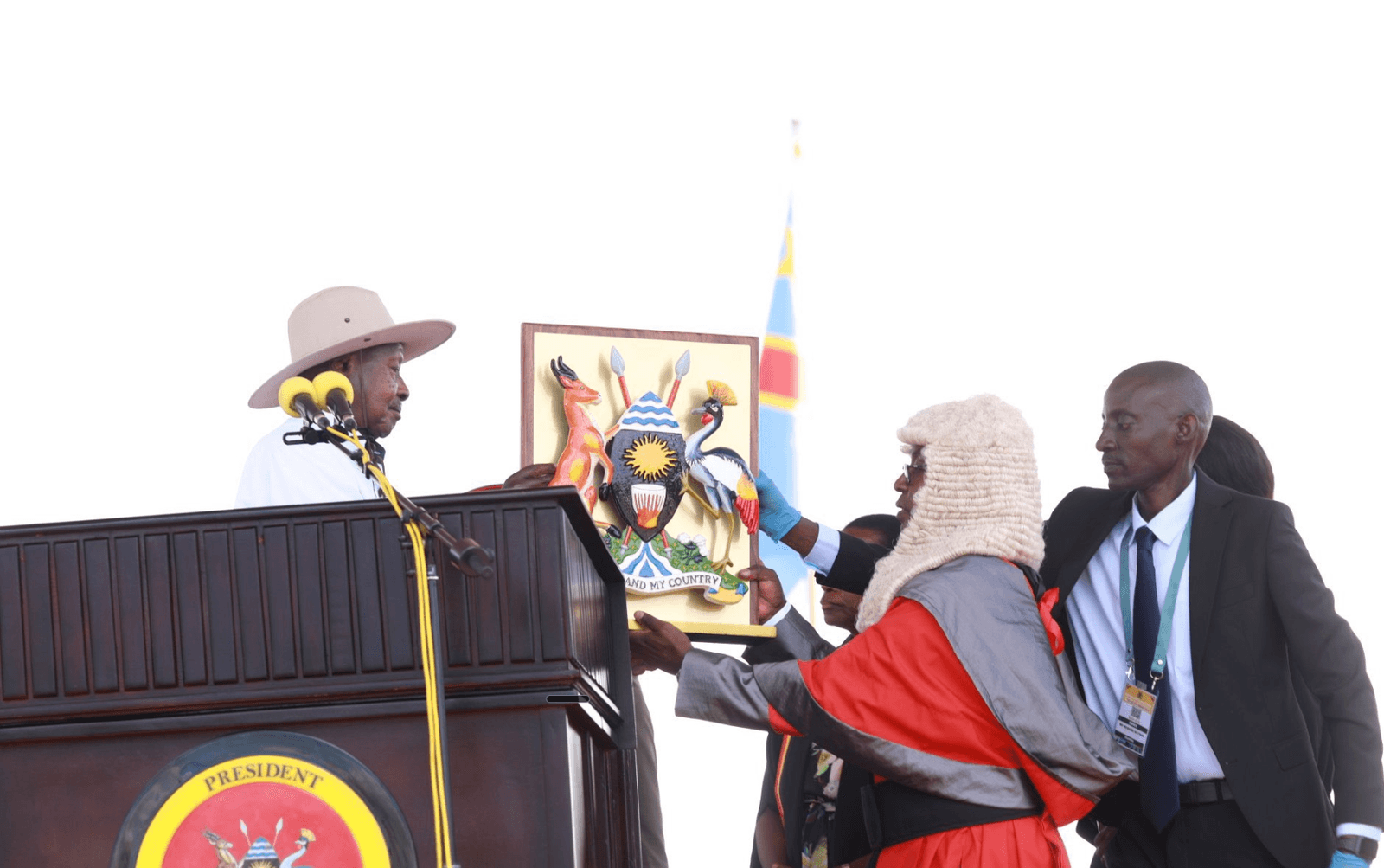 Yoweri Museveni raises his right hand to take the oath of office at Kololo Independence Grounds in Kampala, with Chief Justice Flavian Zeija beside him.