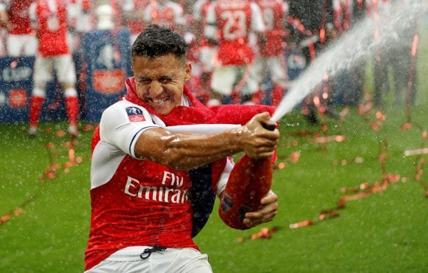 Britain Soccer Football Arsenal v Chelsea FA Cup Final Wembley Stadium 27517 Arsenals Alexis Sanchez celebrates by spraying sparkling wine at the end of the match Action Images via Reuters John Sibley EDITORIAL USE ONLY No use with unauthorized audio video data fixture lists clubleague logos or live services Online in match use limited to 45 images no video emulation No use in betting games or single clubleagueplayer publications Please contact your account representative for further details | Report Focus News