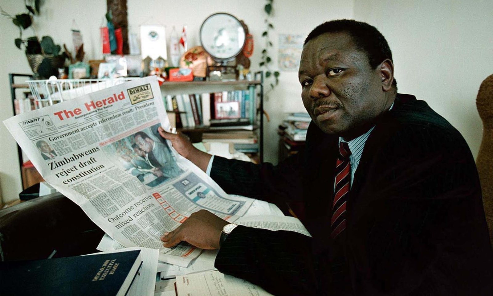 Tsvangirai reads about the governments shock defeat in a referendum on a proposed new constitution in February 2000 | Report Focus News