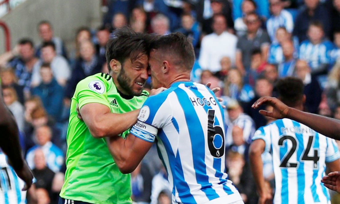Huddersfield’s Jonathan Hogg clashes with Cardiff’s Harry Arter, leading to Hogg being sent off.