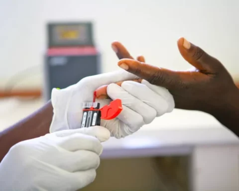 A Zimbabwean health worker administers an HIV test