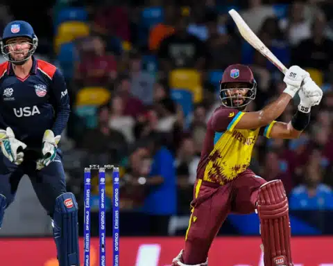 West Indies Shai Hope hits a six as the United States Andries Gous looks on during their ICC men s T20 World Cup match Picture Randy Brooks AFP | Report Focus News