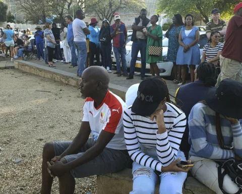 Namibian voters queuing with chairs and umbrellas outside polling station in Windhoek | Report Focus News